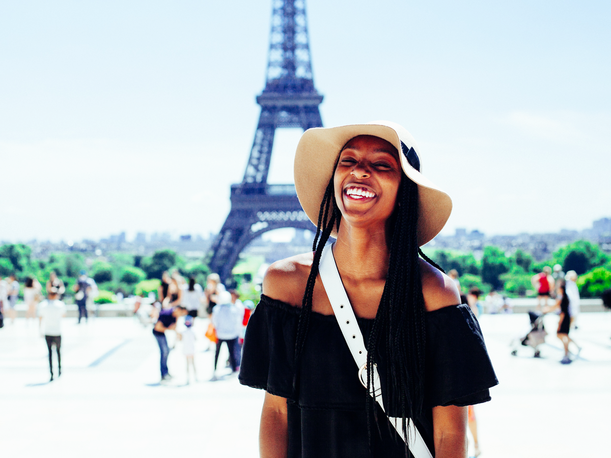 Eiffel tower with smiling person