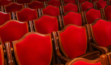 Closeup of red theatre seats