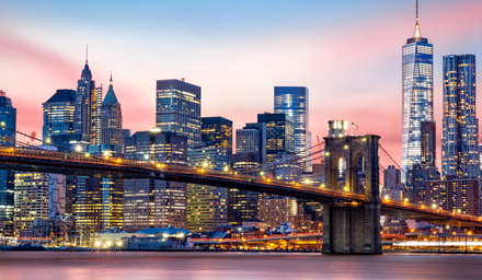 New York City skyline at night, large steel buildings