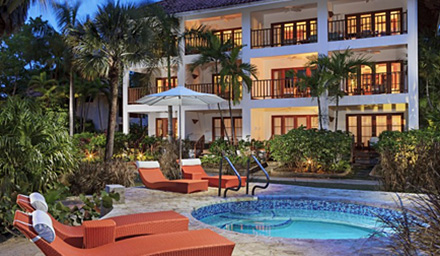A jacuzzi with orange lounge chairs at a Couples Resort in the Caribbean