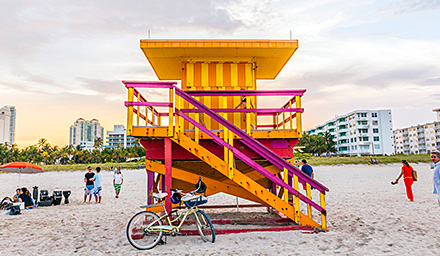Bright yellow and orange lifeguard stand on a beach in Florida