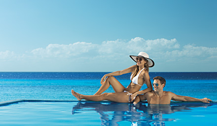 Beautiful couple in an infinity pool