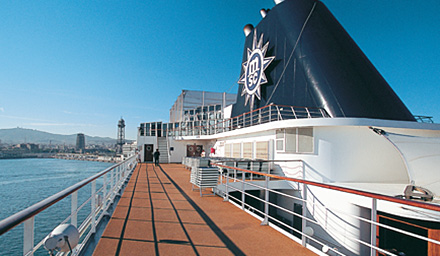 MSC Cruises deck with exhaust tower sailing close to land