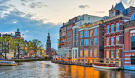 Waterway in the Netherlands with brick buildings lining the canal
