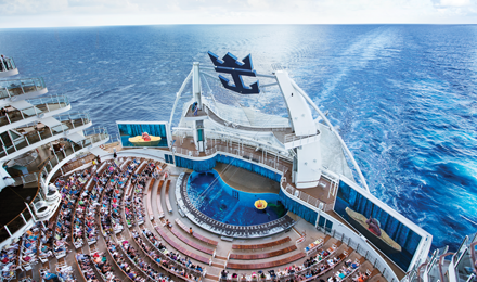 Young girl on a surfboard on Royal Caribbean Flo Rider